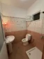 Private en-suite bathroom with a modern shower in the Budget Triple Room at Kolagji Rooms.
