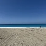 Explore 3 Clear blue sky and pristine coastline at the beautiful Shpella Beach in Lukovë, Albania.