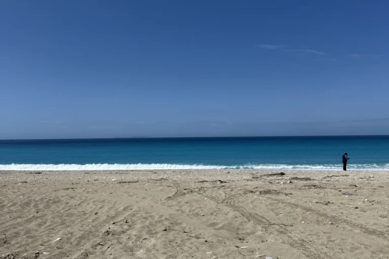 Clear blue sky and pristine coastline at the beautiful Shpella Beach in Lukovë, Albania.