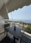 Relaxing private balcony space with a panoramic sea view at Kolagji Rooms on the Albanian Riviera.