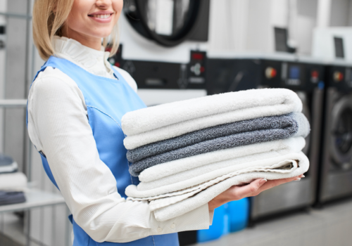 Professional laundry service providing fresh, beautifully folded towels for our guests' comfort.